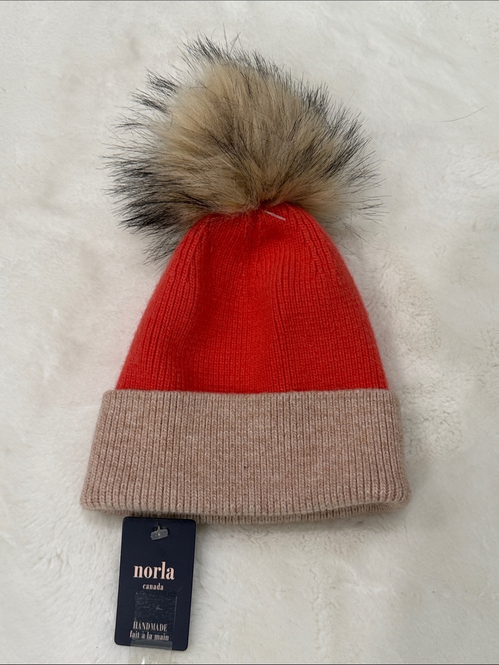 Norla Canada Two-Tone Coral and Beige Winter Hat with Pom Pom NWT